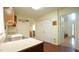 Functional kitchen area with sink, cabinets, and adjacent entryways to other rooms at 516 Ryan Rd, Cary, NC 27511