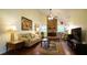 Warm living room with a stone fireplace, comfortable sofa, and hardwood floors at 516 Ryan Rd, Cary, NC 27511