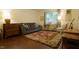 Comfortable living room featuring a sofa, workspace, and well-placed lighting at 516 Ryan Rd, Cary, NC 27511
