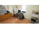 The room has a desk and rolling chair, with shelving and a dresser for storage at 516 Ryan Rd, Cary, NC 27511