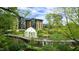 Scenic park view with a walking bridge, gazebo, and upscale buildings at 516 Ryan Rd, Cary, NC 27511