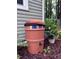 Exterior view of a RainStation rain barrel in a landscaped yard at 516 Ryan Rd, Cary, NC 27511