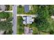 An aerial view showing a home and its landscaped yard nestled in a neighborhood with tree-lined streets at 523 Vick Ave, Raleigh, NC 27612