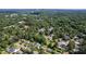 A sprawling cityscape is captured from above, with houses and trees dotting the landscape at 523 Vick Ave, Raleigh, NC 27612