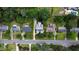 An aerial view of a property in a neighborhood, surrounded by greenery and other well-maintained homes at 523 Vick Ave, Raleigh, NC 27612