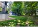 Well-maintained backyard with lush lawn, storage shed, and privacy fence at 523 Vick Ave, Raleigh, NC 27612
