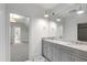 Elegant bathroom with double vanity, granite countertop, and modern lighting fixtures at 523 Vick Ave, Raleigh, NC 27612