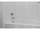 Bathroom with a clean white tub and white subway tile at 523 Vick Ave, Raleigh, NC 27612