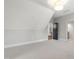 Bright, carpeted room with grey walls and a view into other rooms via doorways at 523 Vick Ave, Raleigh, NC 27612