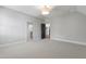 Well-lit bedroom featuring neutral colors, wall-to-wall carpet, and multiple doorways at 523 Vick Ave, Raleigh, NC 27612