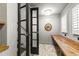 Cozy bonus room with beadboard walls, french doors, wood countertop, and brick floors at 523 Vick Ave, Raleigh, NC 27612