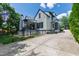 The rear exterior showcases a two-story home, complete with a deck, patio, and a concrete path at 523 Vick Ave, Raleigh, NC 27612