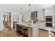 Modern kitchen featuring stainless steel appliances, a large island, custom cabinets, and hardwood floors at 523 Vick Ave, Raleigh, NC 27612