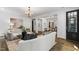 Bright and inviting living room featuring hardwood floors, neutral furnishings, and a decorative chandelier at 523 Vick Ave, Raleigh, NC 27612