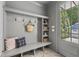 Welcoming mudroom with built-in storage and gray wainscoting at 523 Vick Ave, Raleigh, NC 27612