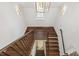 Top-down view of an elegant wooden staircase, highlighting natural light and architectural design at 523 Vick Ave, Raleigh, NC 27612