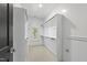 Bright walk-in closet with built-in shelving, hanging rods, and a window at 523 Vick Ave, Raleigh, NC 27612