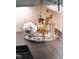 Wet bar featuring a mirrored tray with drinks and a decorative backsplash, perfect for entertaining at 523 Vick Ave, Raleigh, NC 27612