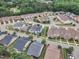 Aerial view of a well-planned residential neighborhood surrounded by lush greenery and trees at 533 Duchart Ln, Fuquay Varina, NC 27526