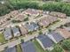 Aerial view of a neighborhood featuring sidewalks, mature landscaping, and a variety of home styles at 533 Duchart Ln, Fuquay Varina, NC 27526