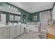 Bathroom featuring double vanity, a soaking tub, and a glass-enclosed shower at 533 Duchart Ln, Fuquay Varina, NC 27526