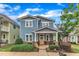 Charming two-story home with a welcoming front porch and professionally landscaped yard at 533 Duchart Ln, Fuquay Varina, NC 27526