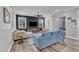 Comfortable living room featuring stylish decor, a dark accent wall, and natural light at 533 Duchart Ln, Fuquay Varina, NC 27526