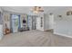 Carpeted living room with guitar and blue curtains at 533 Duchart Ln, Fuquay Varina, NC 27526