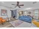 Bright living room with hardwood floors, ceiling fan, and comfortable seating arrangement at 533 Duchart Ln, Fuquay Varina, NC 27526