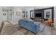 Comfortable living room featuring stylish decor, a dark accent wall, and natural light at 533 Duchart Ln, Fuquay Varina, NC 27526