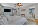 Primary bedroom with ensuite bath access featuring a TV and neutral tones at 533 Duchart Ln, Fuquay Varina, NC 27526