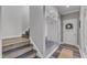Hallway featuring custom built-in mudroom storage with bench, hooks, and overhead cabinets at 533 Duchart Ln, Fuquay Varina, NC 27526