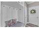 Mudroom featuring built-in seating with overhead cabinets and decor at 533 Duchart Ln, Fuquay Varina, NC 27526