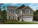 Charming two-story home with a manicured lawn and an attached two-car garage at 535 Claftin St, Sanford, NC 27330