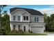 Charming two-story home featuring white siding, a two-car garage, and a welcoming front porch at 539 Claftin St, Sanford, NC 27330