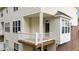 Charming balcony featuring a white railing and a window, providing an inviting outdoor space at 5503 Silver Moon Ln, Raleigh, NC 27606