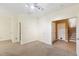 Bedroom with neutral carpet, track lighting and an adjacent staircase through the open doorway at 5503 Silver Moon Ln, Raleigh, NC 27606
