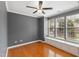 Charming bedroom featuring hardwood floors, gray walls, and a ceiling fan at 5503 Silver Moon Ln, Raleigh, NC 27606