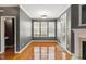 Cozy dining room features hardwood floors, a fireplace, and multiple windows providing ample natural light at 5503 Silver Moon Ln, Raleigh, NC 27606