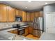 Modern kitchen features stainless steel appliances, plenty of cabinet space, and ample countertop for food preparation at 5503 Silver Moon Ln, Raleigh, NC 27606