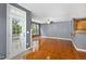 Bright living room with access to a deck, a cozy fireplace, and seamless flow to the adjacent kitchen with a breakfast bar at 5503 Silver Moon Ln, Raleigh, NC 27606
