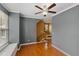 Inviting living room with hardwood floors, a ceiling fan, and staircase access to other levels of the home at 5503 Silver Moon Ln, Raleigh, NC 27606