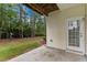 Back patio providing a relaxing outdoor space with views of the lawn and surrounding trees at 5503 Silver Moon Ln, Raleigh, NC 27606