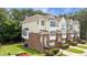 Features include a well-maintained lawn, complemented by brick and siding exteriors, plus a small balcony at 5503 Silver Moon Ln, Raleigh, NC 27606
