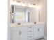 Bathroom with a double sink vanity, quartz countertop, and modern fixtures at 56 Braddock Ct, Garner, NC 27529