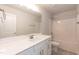 Bright bathroom featuring a tub-shower combo, white vanity, and modern fixtures at 56 Braddock Ct, Garner, NC 27529