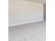 An empty bedroom with plush carpeting, neutral walls, and bright natural light at 56 Braddock Ct, Garner, NC 27529