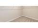Walk-in closet with ample shelving for optimal storage and organization at 56 Braddock Ct, Garner, NC 27529