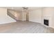 Spacious living room with fireplace and staircase, perfect for entertaining at 56 Braddock Ct, Garner, NC 27529
