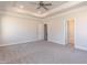 Large main bedroom featuring a tray ceiling and plush carpeting at 56 Braddock Ct, Garner, NC 27529